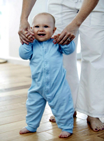 toddler walking with parent